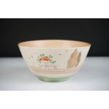 Clarice Cliff Bowl decorated with fruits, flowers, foliage and stars on a cream ground, 14cm