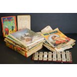A small collection of mid century children's books and comics together with a glockenspiel.