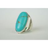 Silver ring set with large turquoise cabochon