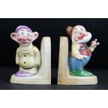 Pair of 1950's Continental Ceramic Bookends in the form of Snow White's Dwarfs Happy and Dopey