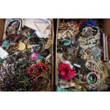 A large collection of vintage and contemporary costume jewellery contained within two boxes.