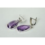 Pair of silver and pear shaped amethyst drop earrings