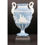 Wedgwood & Bentley Etruria Blue Jasperware Urn standing on a Black Basalt Base, 21cm high