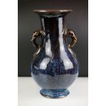 Chinese Jun - type Baluster Vase with twin elephant handles decorated with a dark blue and brown