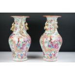 Pair of Chinese Cantonese Famille Rose Baluster Vases decorated with panels of figures and floral