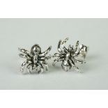 Pair of silver spider style stud earrings