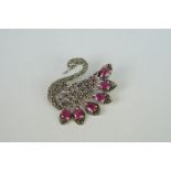 Silver swan brooch set with rubies