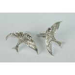 Pair of silver cufflinks in the form of swallows