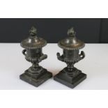 Pair of 19th century French Bronze Urn Candlesticks of Campana form with flame finials on reversible