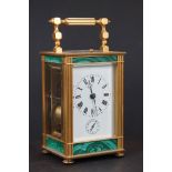 A vintage French made carriage clock with repeating movement, brass cased with decorative