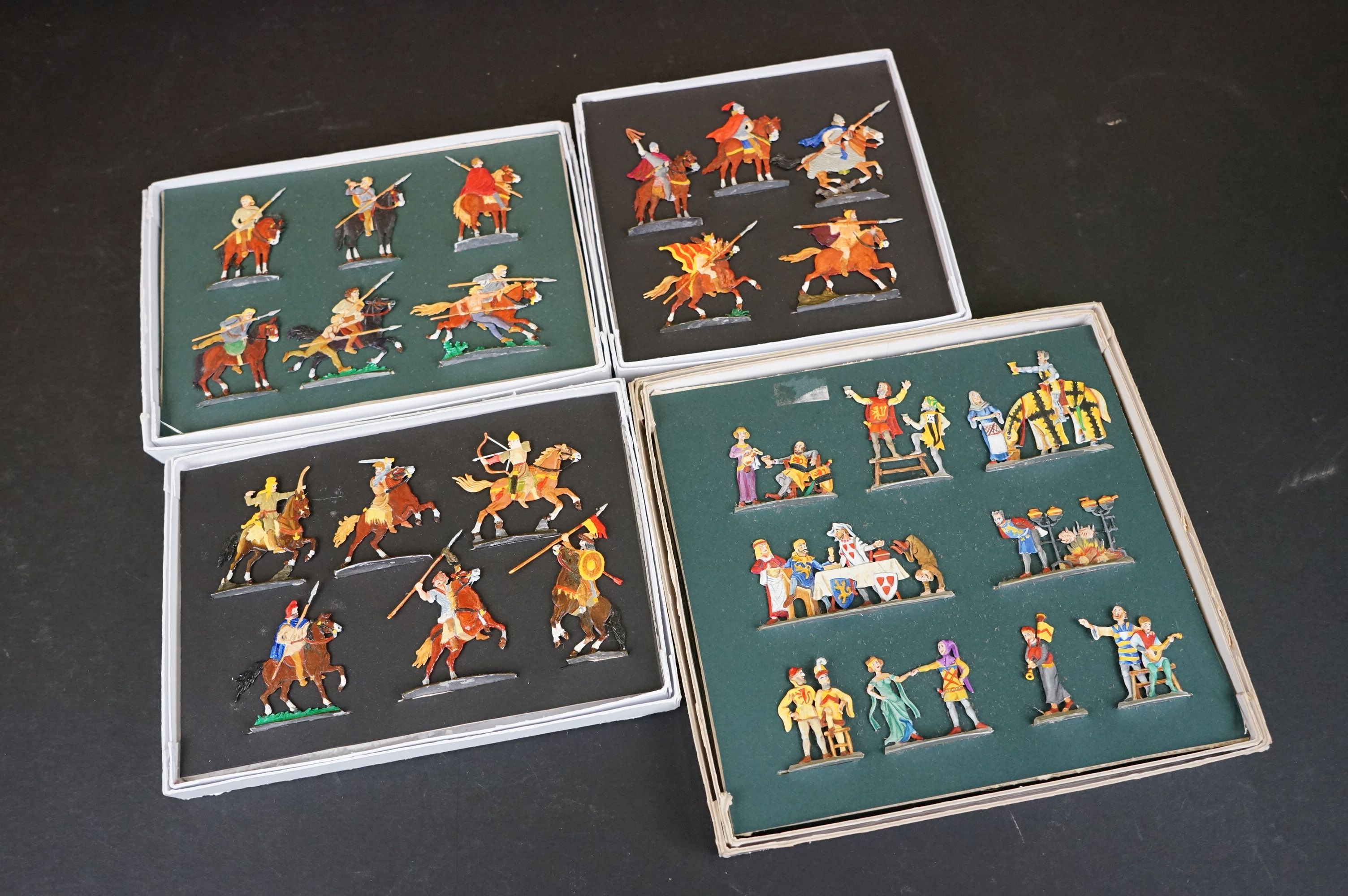 A collection of boxed sets of metal historical figures.