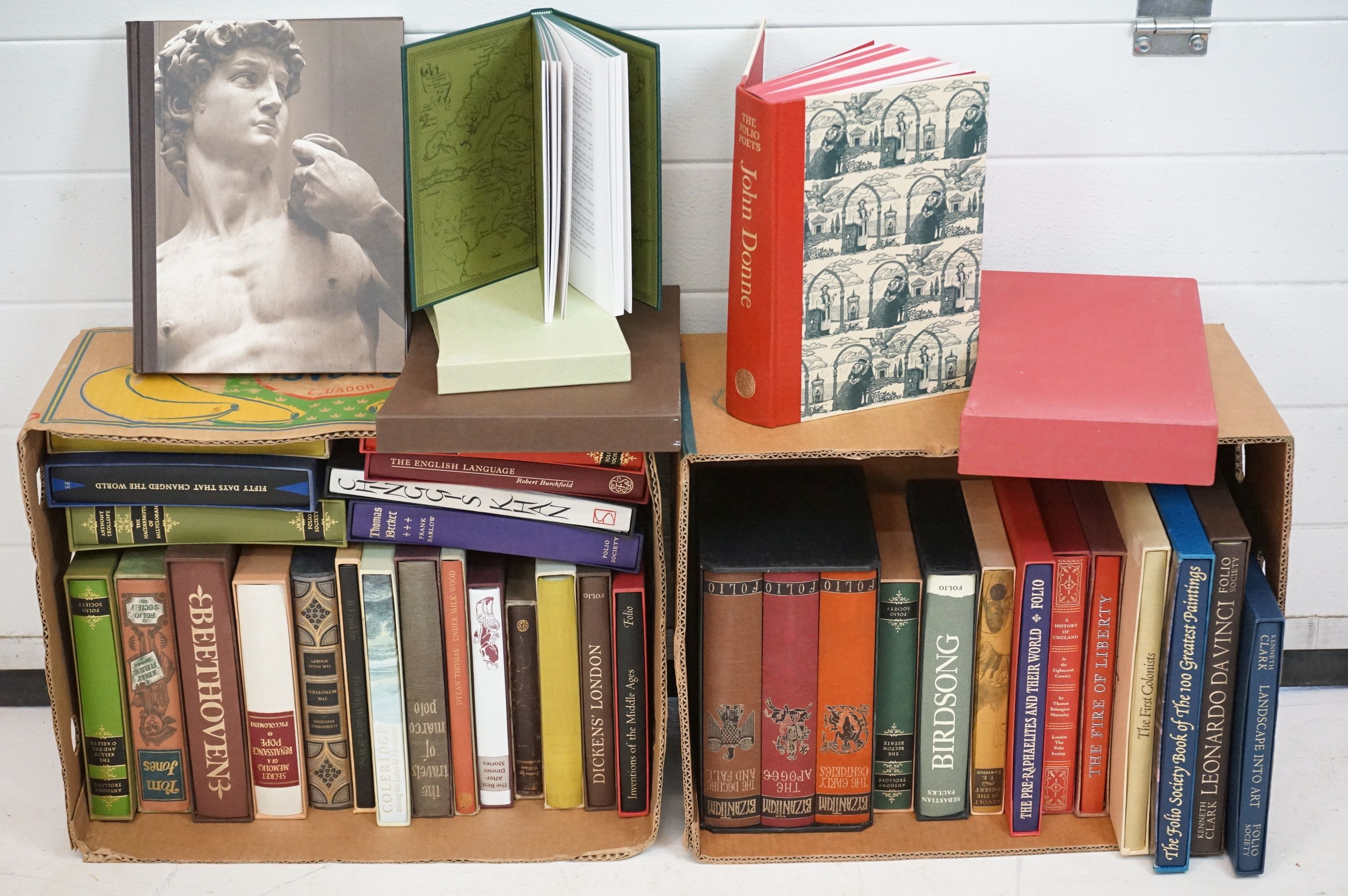 A large collection of Folio society hardback books contained within two boxes.