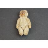 An early 20th century Miniature articulated monkey figure.