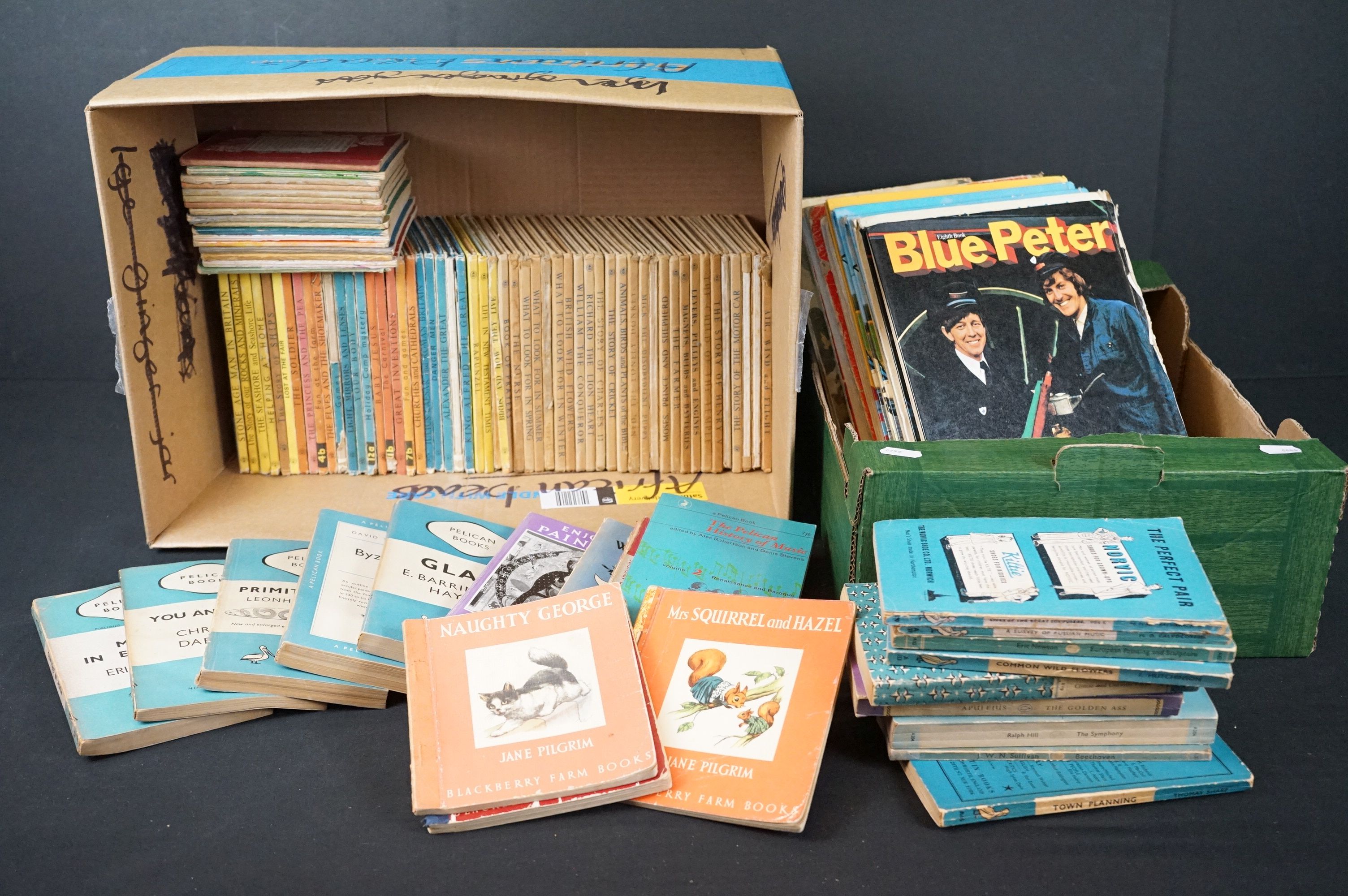 A collection of Ladybird books together with a quantity of children's annuals.