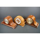 A collection of three mid 20th century wooden cased mantle clocks.