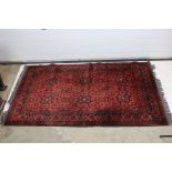 Eastern Red Ground Wool and Silk Blend Rug with geometric pattern, 200cm x 128cm