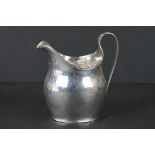 A fully hallmarked sterling silver Georgian cream jug with a London assay mark.