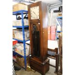 Art Deco Oak Longcase Clock, the square case holding a silvered dial with Arabic numerals, the trunk