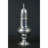 A fully hallmarked sterling silver sugar shaker, assay marked for London.