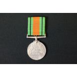 A Full Size British World War Two 1939-1945 Defence Medal With Correct And Original Ribbon.