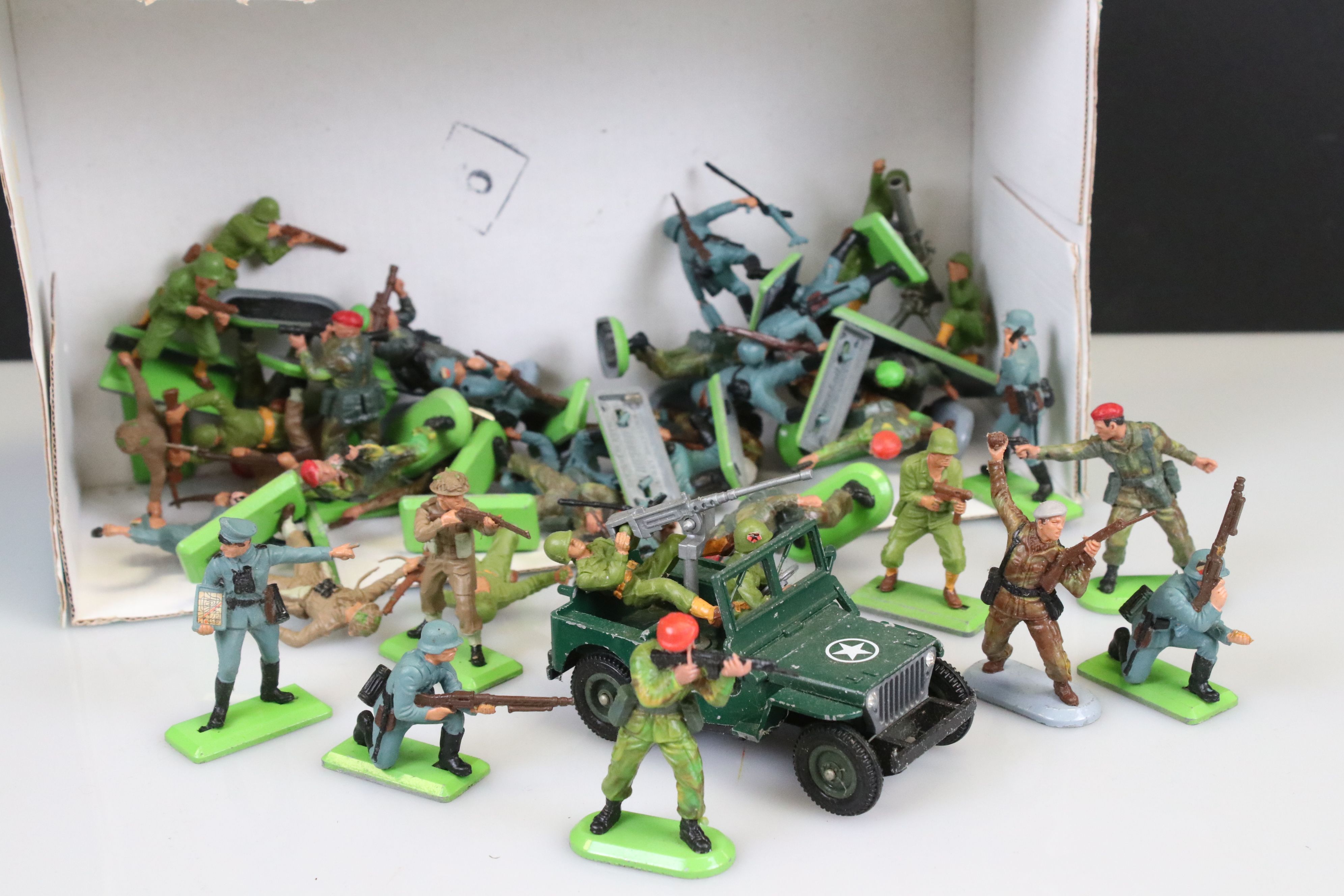 Around 38 Britains Deetail military figures plus a Britains Jeep diecast model with 2 x soldiers