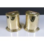 A pair of brass book end containers with hinged lids, stand approx 20cm in height.