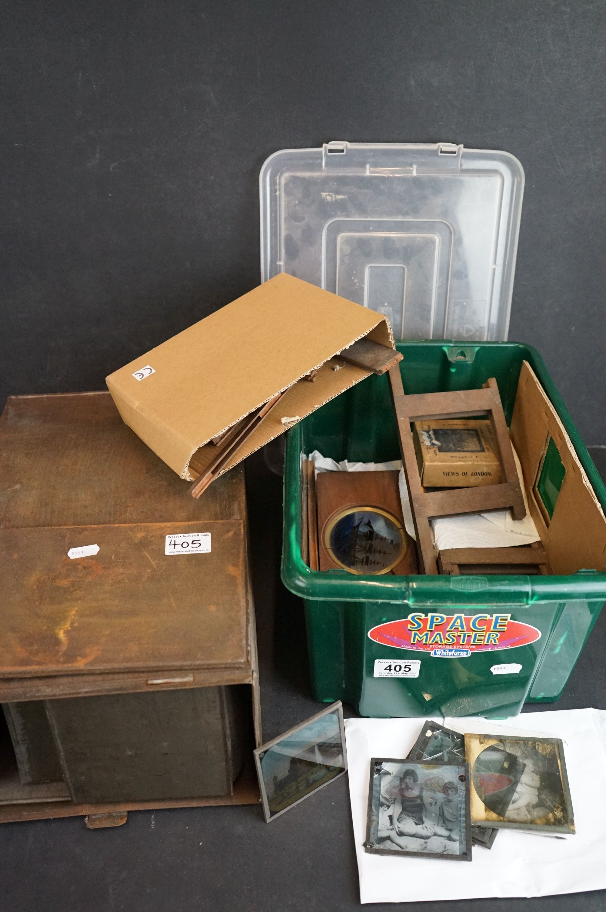 A antique magic lantern slide projector together with a quantity of glass slides.