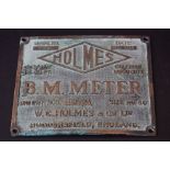 Brass plaque advertising Holmes B M Meter, Huddersfield, England, dated August 1938