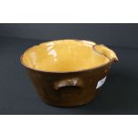 19th century Brown Glazed Dairy Bowl with interior mustard glaze and pouring lip, 24cm high