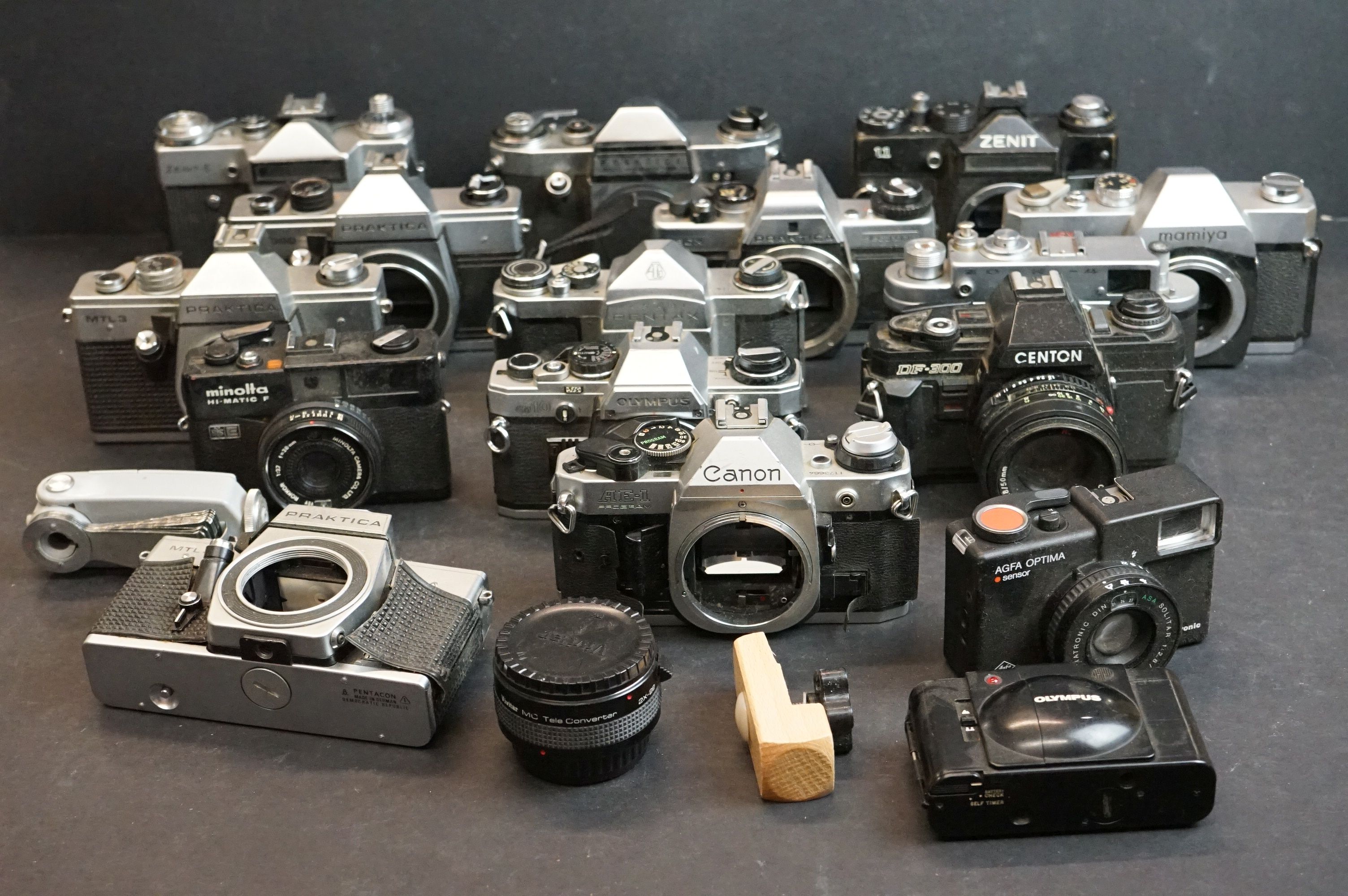 A collection of 35mm SLR camera bodies to include Olympus, Mamiya, Canon, Praktica and Pentax