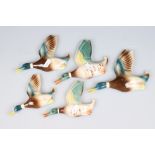 Graduated set of 3 Beswick style pottery flying duck wall plaques (the largest is 18cm long) with