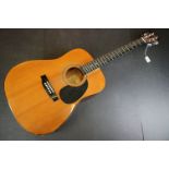 An Encore classical six string acoustic guitar.