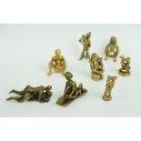 A collection of eight erotic metal figures.