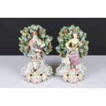 Pair of Chelsea Porcelain Bocage Figures in the form of a Man playing bagpipes with a dog and a