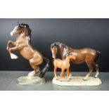 Beswick Brown Rearing Welsh Cob model 1014 together with Beswick Mare and Foal model 953