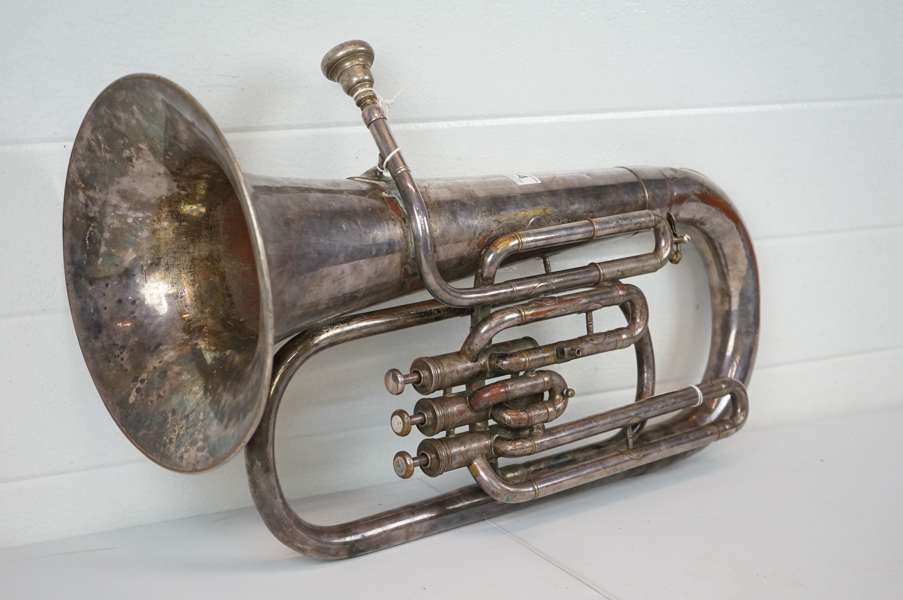 A vintage silver plated three valve euphonium.