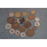 A small collection of foreign and British pre decimal coins.