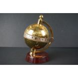 Charles Frodsham of London Globe Clock, brass with silvered chapter ring, raised on a mahogany base,