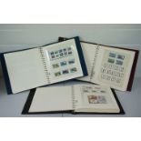 Three Guernsey Lighthouse hingeless stamp albums with near complete collections of Guernsey