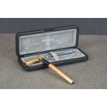 A boxed Parker premier gold plated Grain d'orge (Barleycorn) fountain pen with 18ct gold nib.