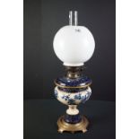 Taylor Tunnicliffe cream and dark blue ceramic Oil Lamp with drop-in font and brass base, Messengers