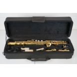 A SMS Academy brass saxophone in original fitted case.