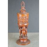 A flemish treen lidded cup with finely carved figural decoration.