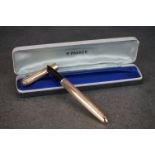 A boxed Parker 51 Insignia rolled gold fountain pen.