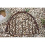 A large wrought iron hay rack, measures approx 80cm in height.