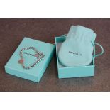 A 925 sterling silver Tiffany bracelet complete with dust bag and gift box.