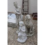 A collection of three reconstituted stone garden statues to include a dog and to figures of