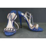 A pair of blue Prada high heel shoes with gold studs and clear jewels, size 41.