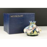 Moorcroft Pottery Squat Vase decorated in the Ivory Bells pattern, boxed, 11cm high