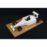 Engineer built metal F1 racing car in white and on wooden stand, made in Holland, model approx